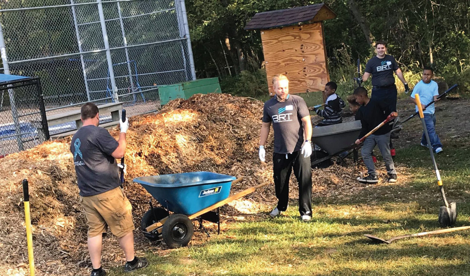 BRT employees volunteering at a park